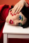 Red themed makeup by Alice Rossi, with blue eyeshadow and green brows.